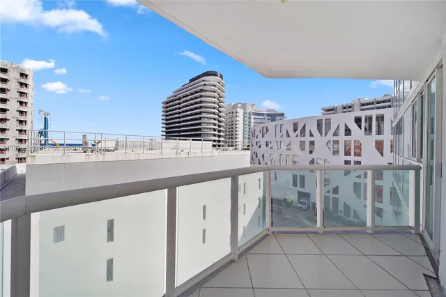 a view of balcony with wooden floor