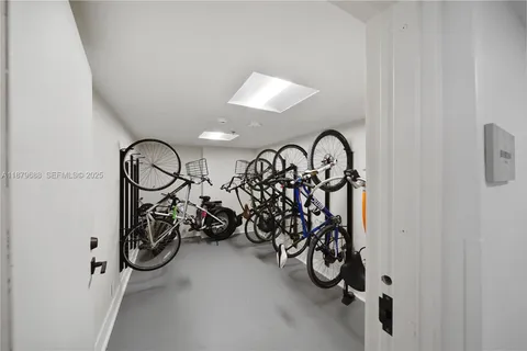 a view of a chairs with potted plants on the roadside