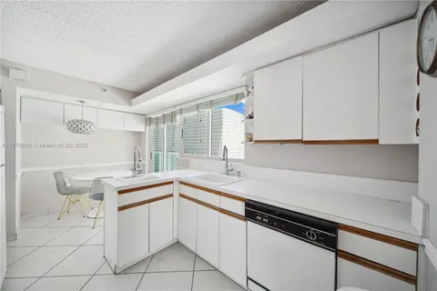 a kitchen with a table and chairs in it
