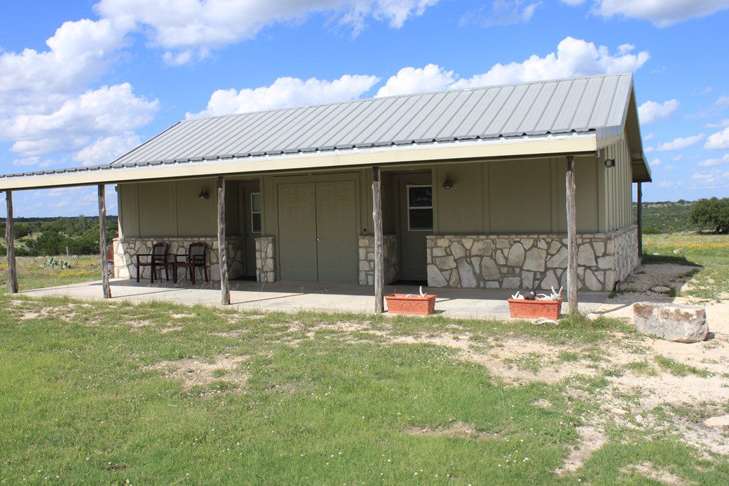 0 Other Junction Junction, TX 76849 - Photo 12 of 17 a view of a house with backyard porch and furniture