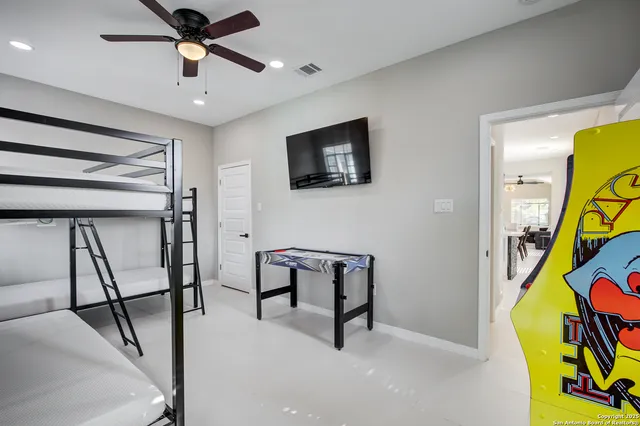 a view of a livingroom with furniture and a flat screen tv