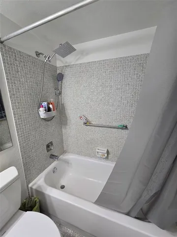 a large body of water with a tree in the background