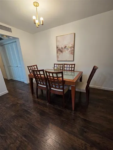 a kitchen with stainless steel appliances a stove a sink and a refrigerator