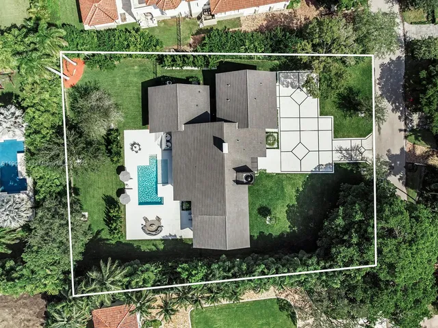 an aerial view of house with outdoor space swimming pool and outdoor seating