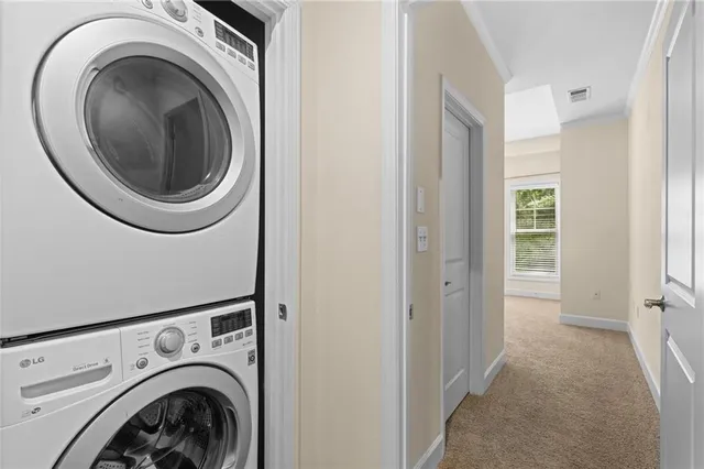 a view of a hallway with washer and dryer
