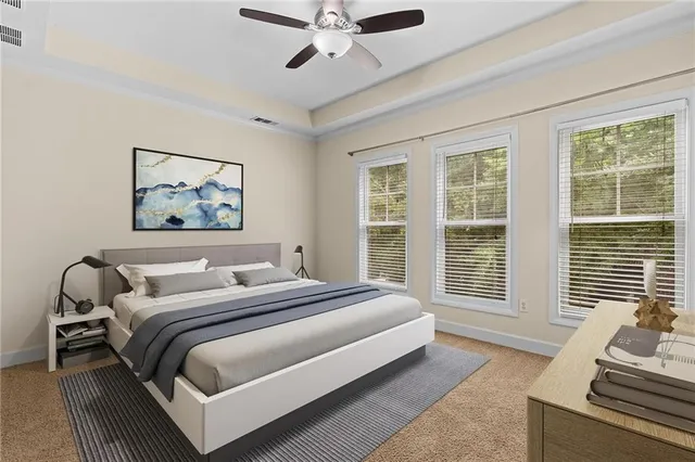 a bedroom with a large bed and a window