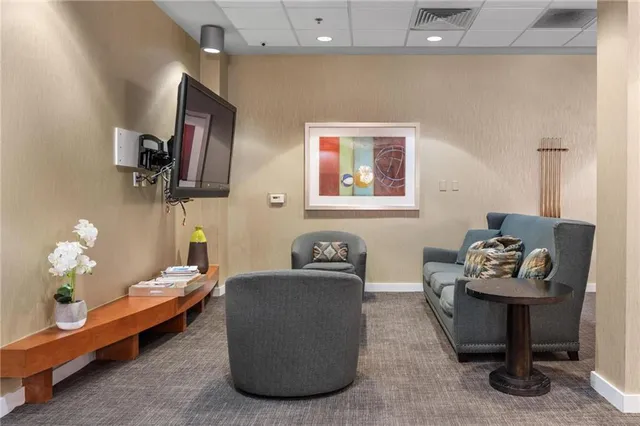 a room with furniture and a clock