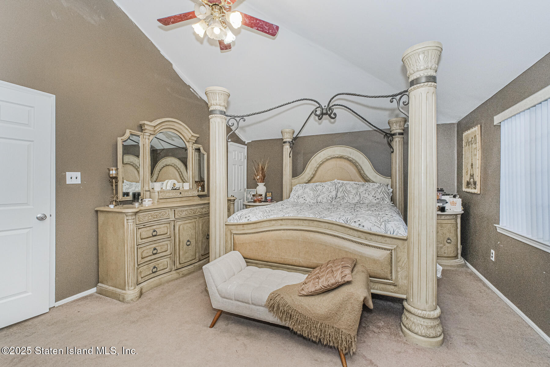 122 Clay Pit Road Staten Island, NY 10309 - Photo 12 of 26 a bedroom with a bed and a dresser