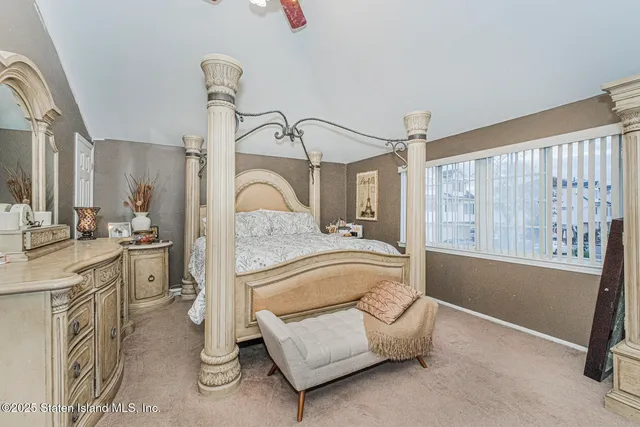 a en suite bathroom with a granite countertop sink and a mirror