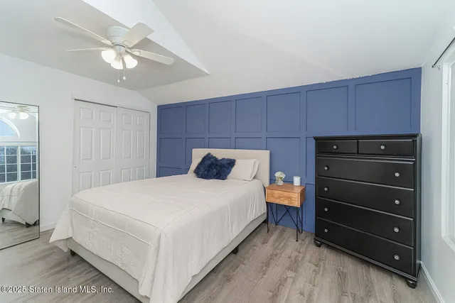 a large white bed in a room