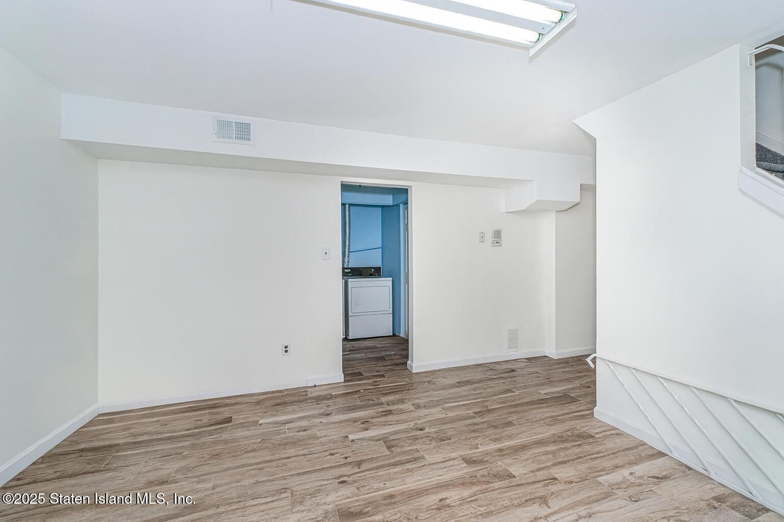 122 Clay Pit Road Staten Island, NY 10309 - Photo 20 of 26 wooden floor in an empty room