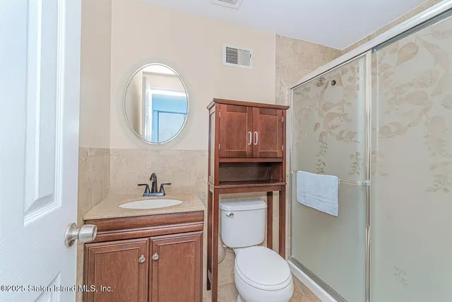 a bathroom with a toilet a sink and bathtub