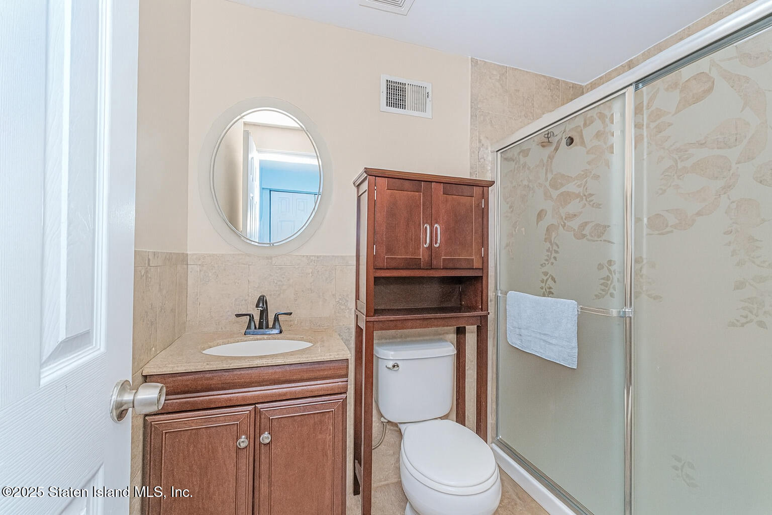 122 Clay Pit Road Staten Island, NY 10309 - Photo 23 of 26 a bathroom with a toilet a sink and bathtub
