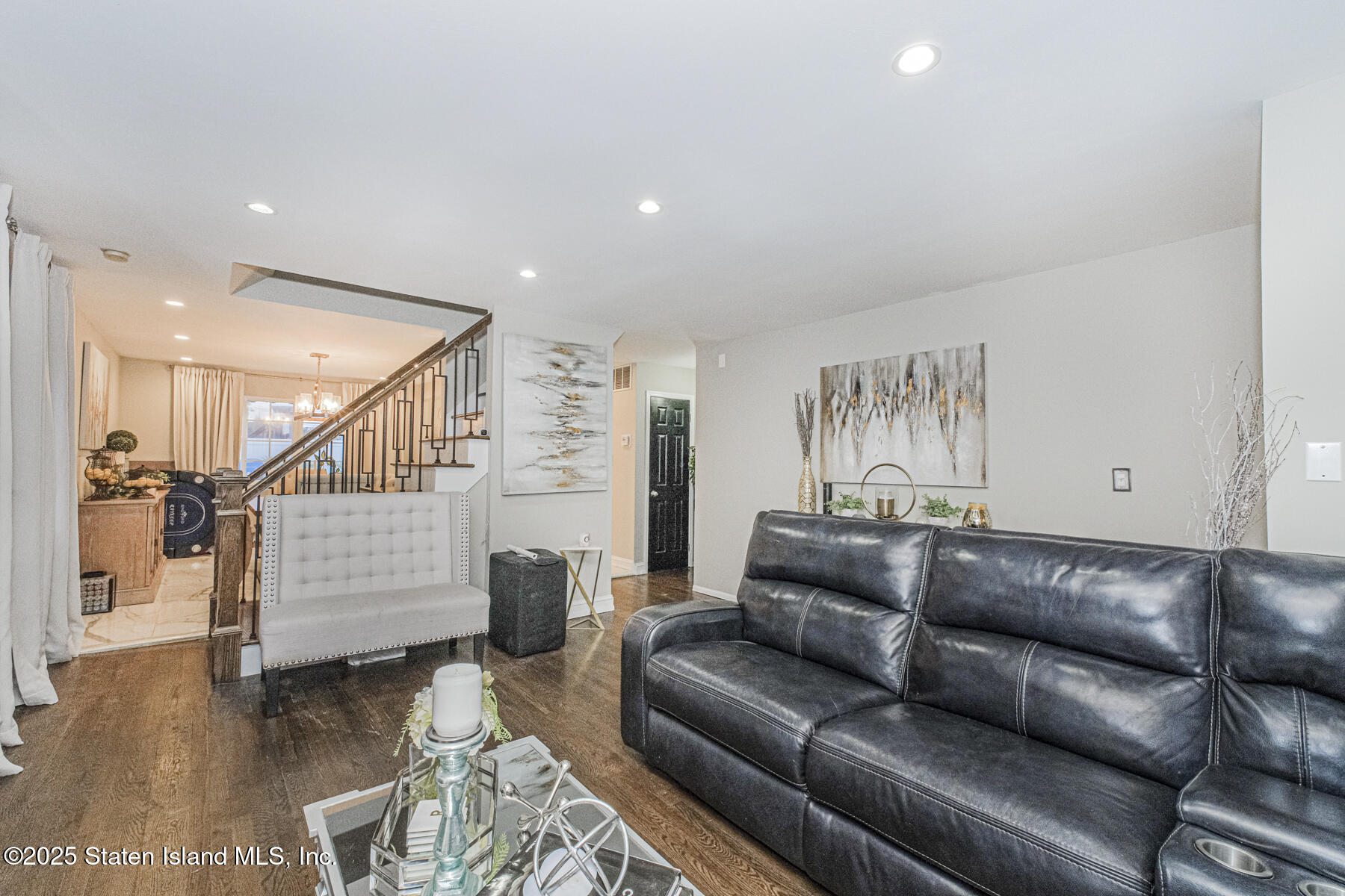122 Clay Pit Road Staten Island, NY 10309 - Photo 4 of 26 a living room with furniture and stairs