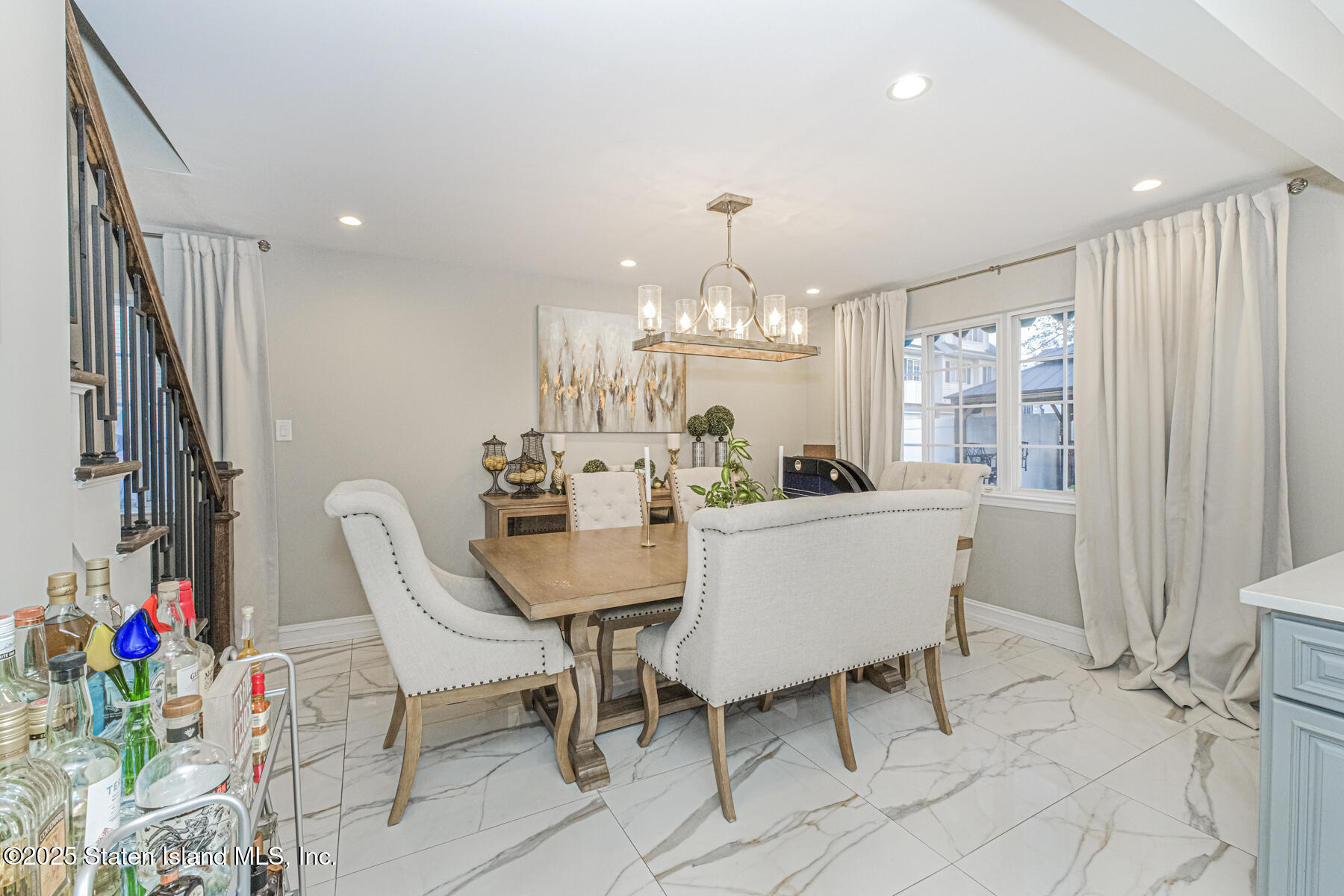 122 Clay Pit Road Staten Island, NY 10309 - Photo 7 of 26 a view of a dining room with furniture window and outside view