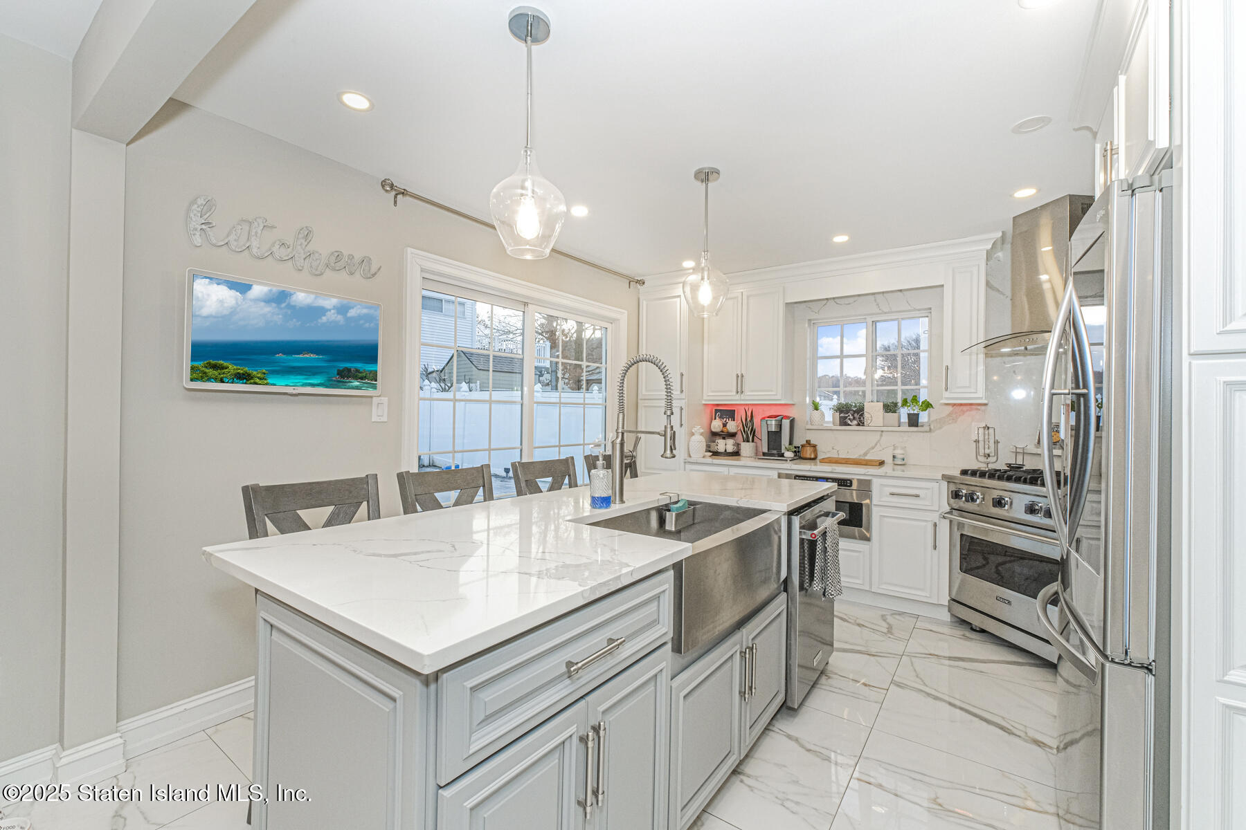 122 Clay Pit Road Staten Island, NY 10309 - Photo 8 of 26 a kitchen with stainless steel appliances granite countertop a sink and a refrigerator