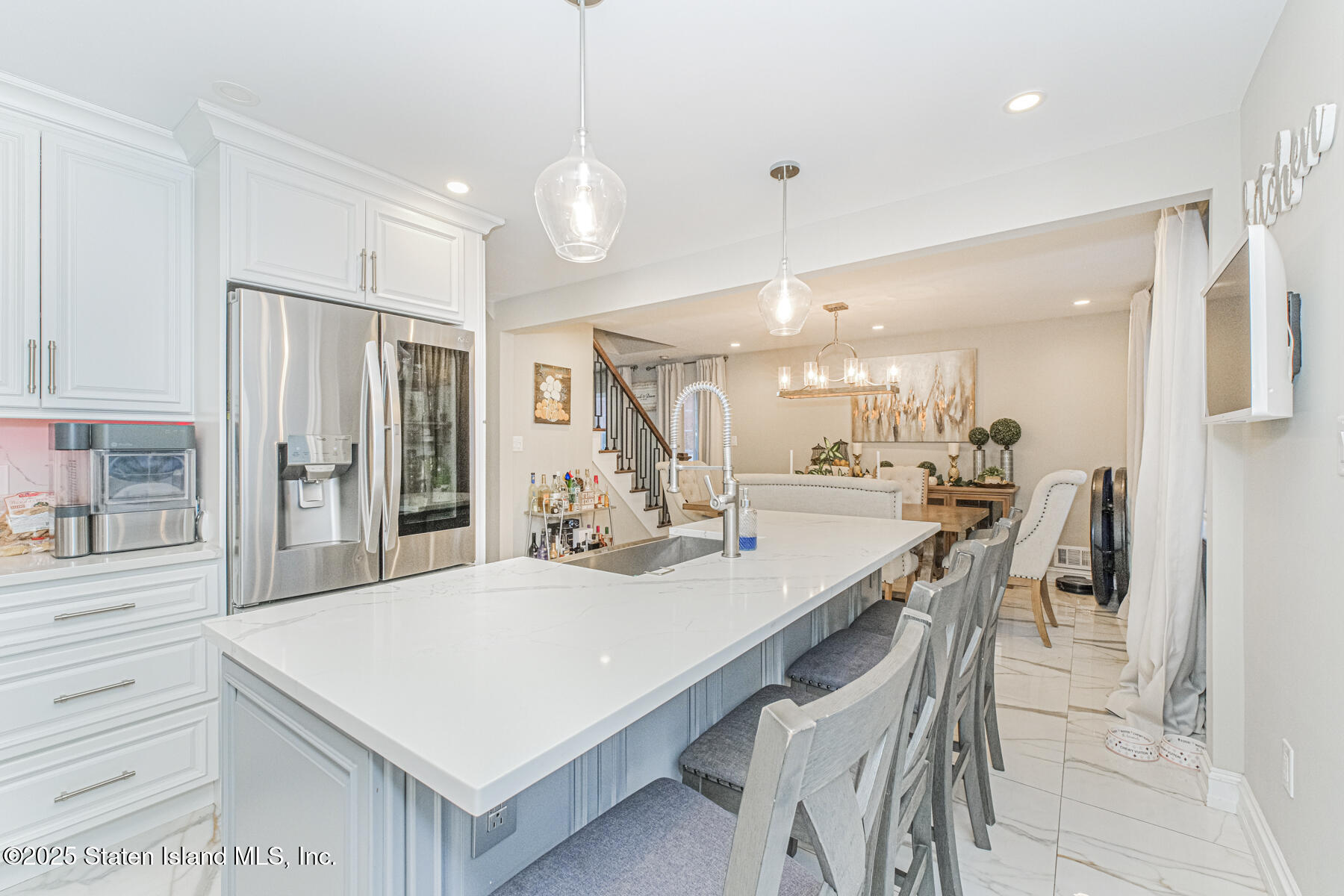 122 Clay Pit Road Staten Island, NY 10309 - Photo 9 of 26 a large kitchen with a kitchen island wooden floor and stainless steel appliances