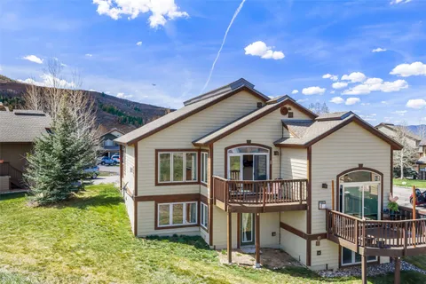 a front view of a house with yard porch and seating area