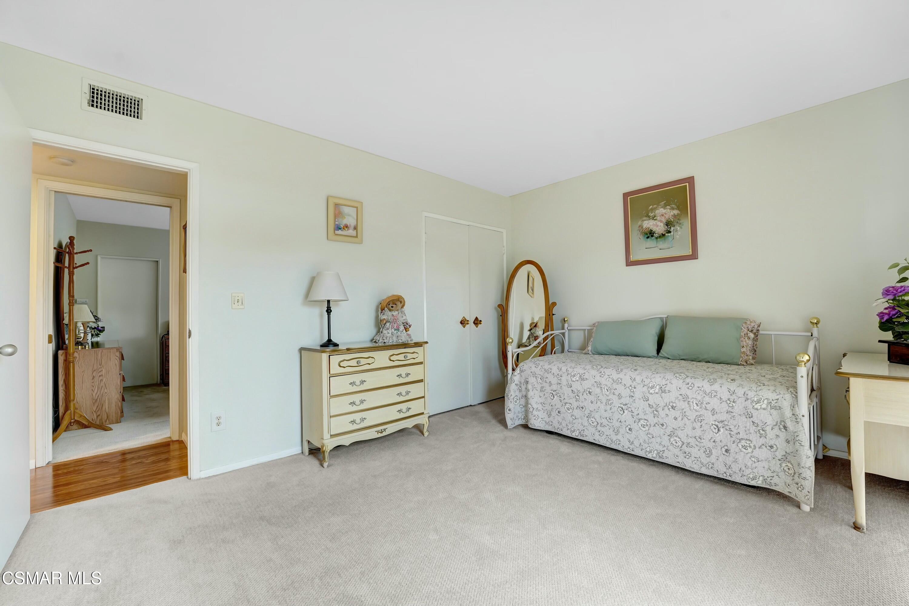 3075 Reservoir Drive Simi Valley, CA 93065 - Photo 11 of 20 a bedroom with a bed and a couch