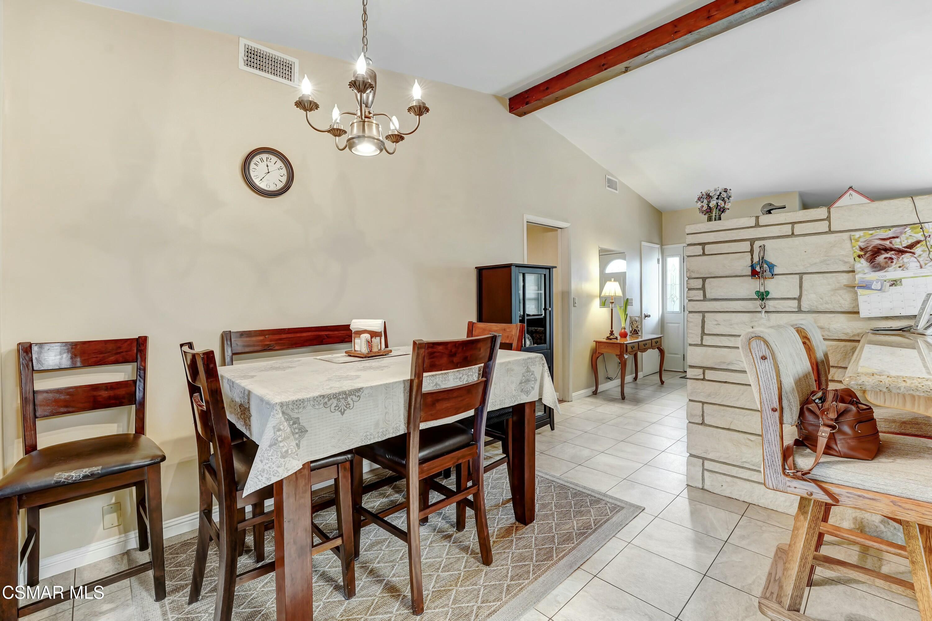 3075 Reservoir Drive Simi Valley, CA 93065 - Photo 5 of 20 a view of a dining room with furniture and a chandelier
