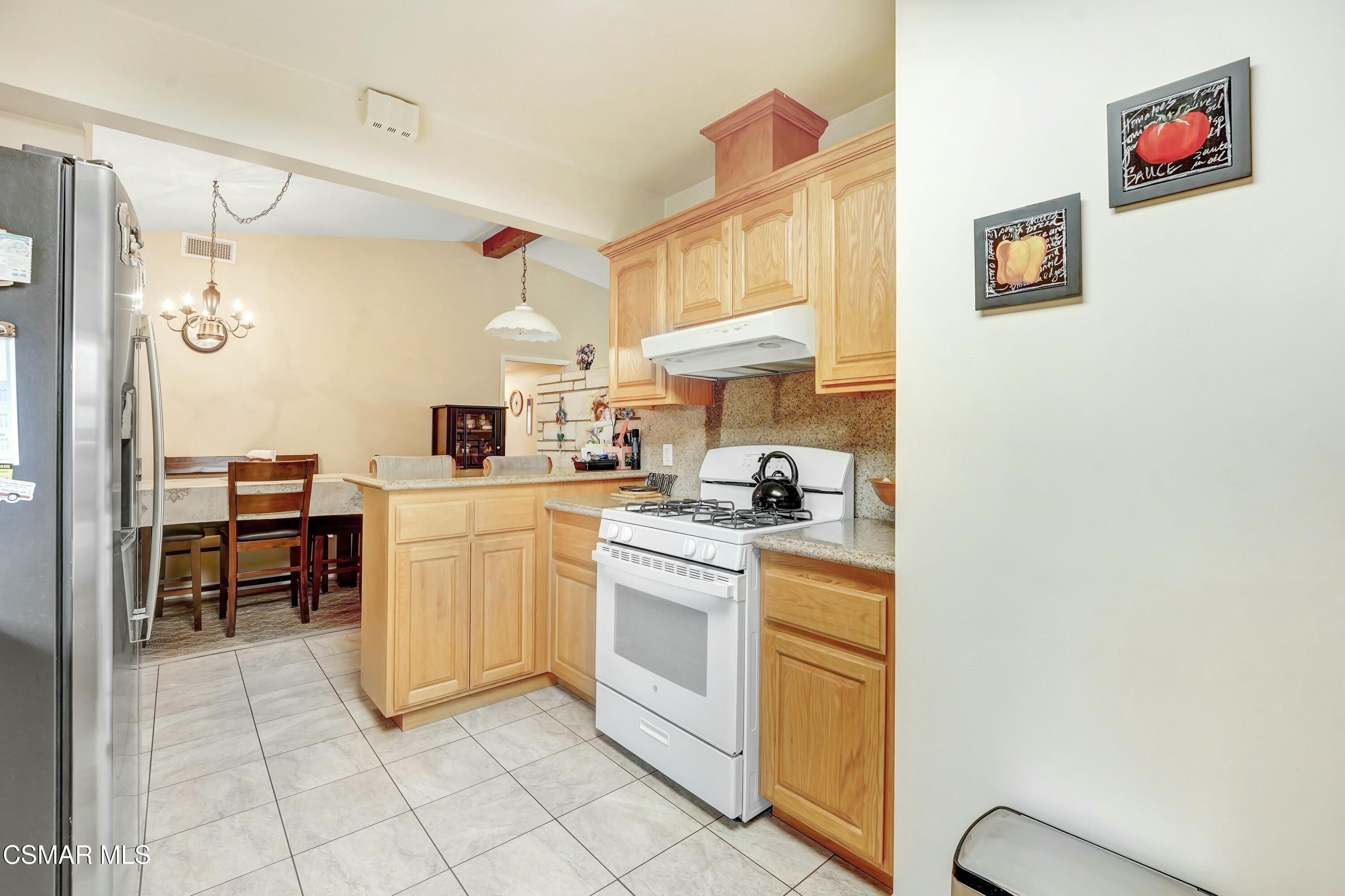 3075 Reservoir Drive Simi Valley, CA 93065 - Photo 7 of 20 a kitchen with cabinets and chairs