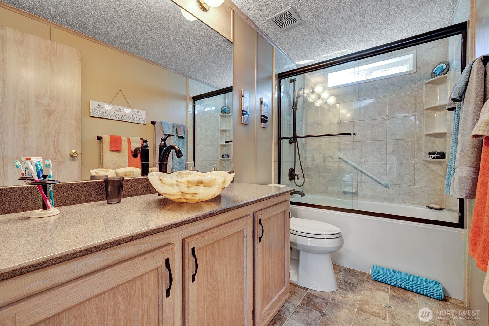 2611 South 288th Street, Unit 2 Federal Way, WA 98003 - Photo 12 of 22 a bathroom with a granite countertop sink toilet and shower
