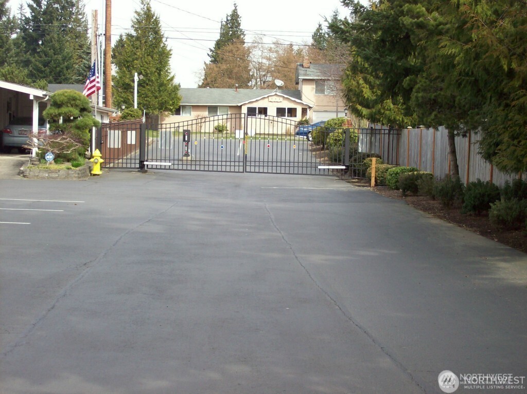 2611 South 288th Street, Unit 2 Federal Way, WA 98003 - Photo 19 of 22 a front view of a house with a garden
