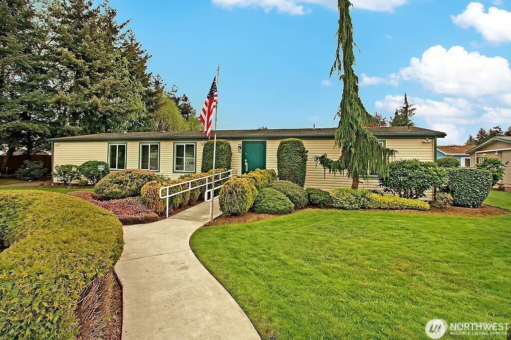2611 South 288th Street, Unit 2 Federal Way, WA 98003 - Photo 20 of 22 a view of a house with backyard and a tree