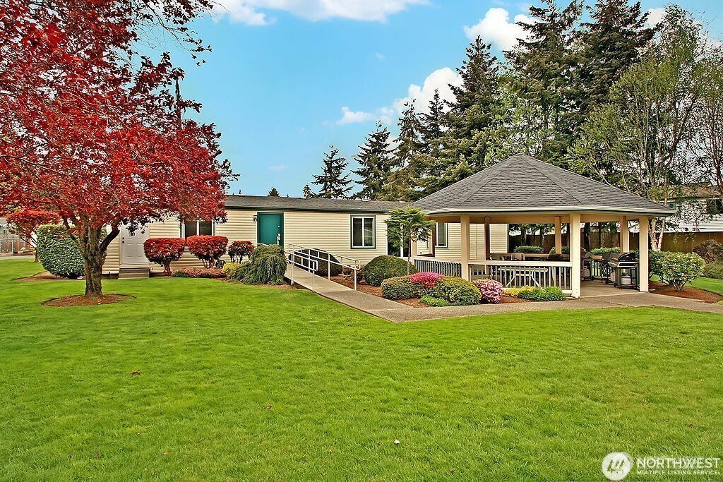 2611 South 288th Street, Unit 2 Federal Way, WA 98003 - Photo 21 of 22 a front view of a house with garden