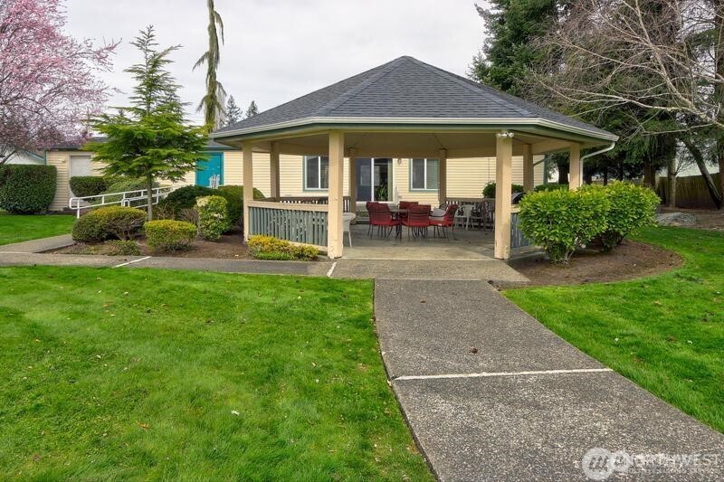 2611 South 288th Street, Unit 2 Federal Way, WA 98003 - Photo 22 of 22 a view of a house with a yard porch and sitting area