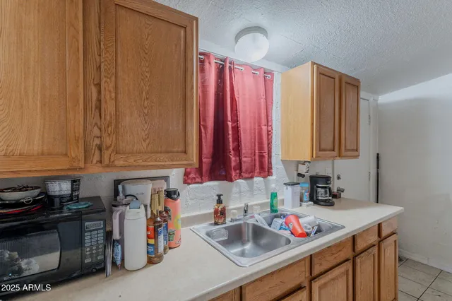 a living room with furniture and a chair