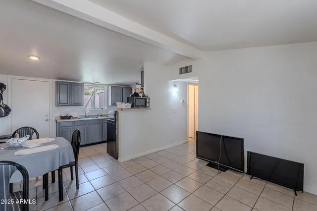 a kitchen with a sink cabinets and appliances