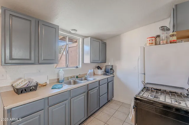 a kitchen with a stove and a refrigerator