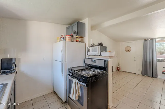 a bathroom with a sink mirror and toilet