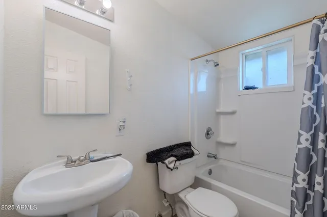 a bedroom with a bed and cabinets