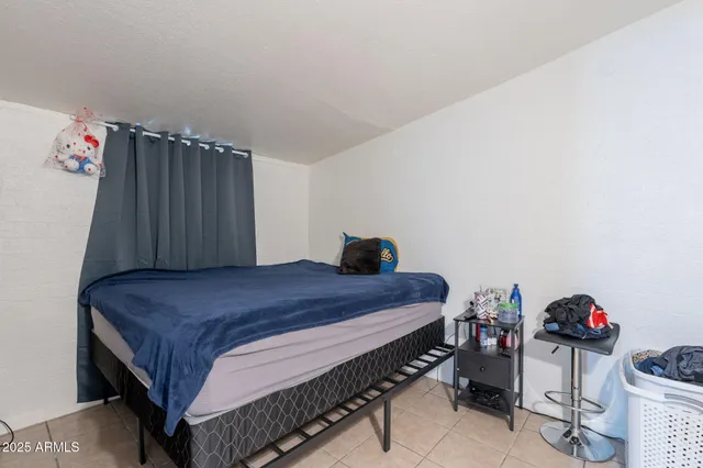 a bed room with a bed and a couch