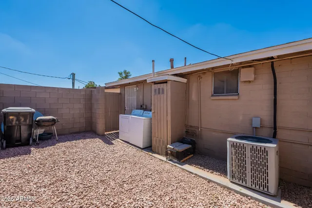 a bedroom with a bed and a chair