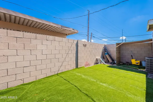 a backyard of a house with seating space