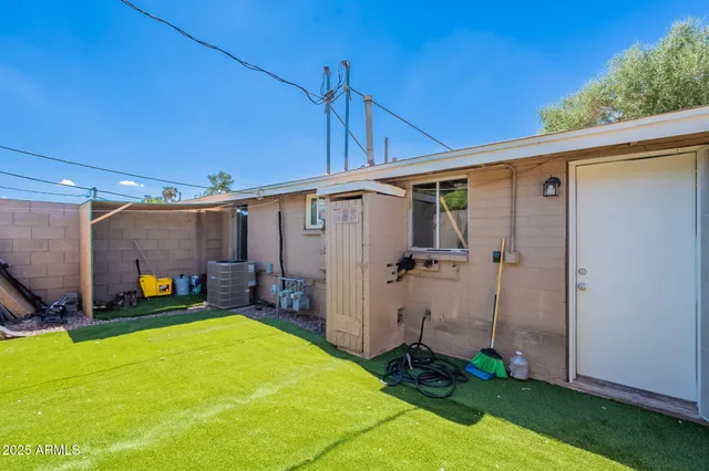 a view of a backyard with potted plants