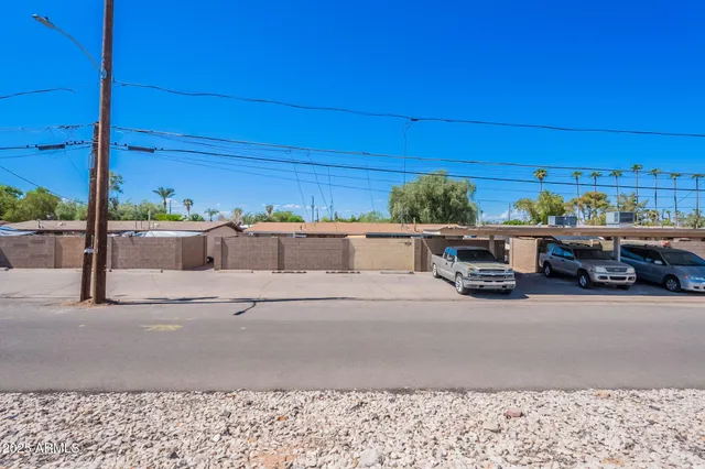a view of a car park in front of a house