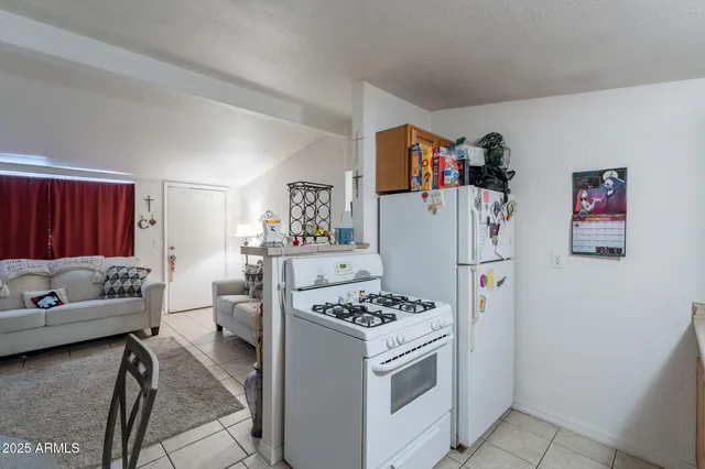 a kitchen with a sink cabinets and window