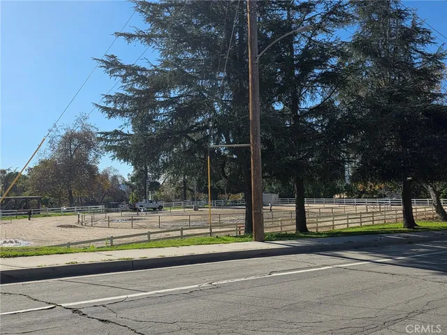 a spacious bedroom with furniture and a fireplace
