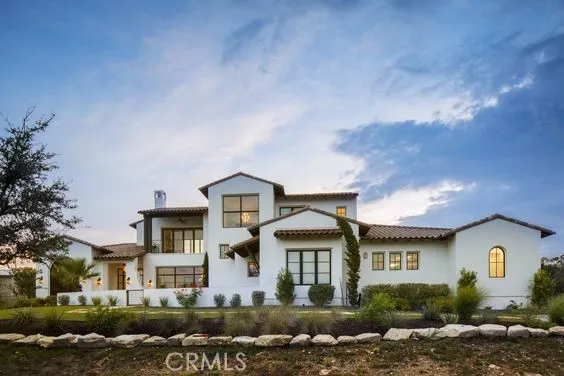 a living room with furniture and a book shelf