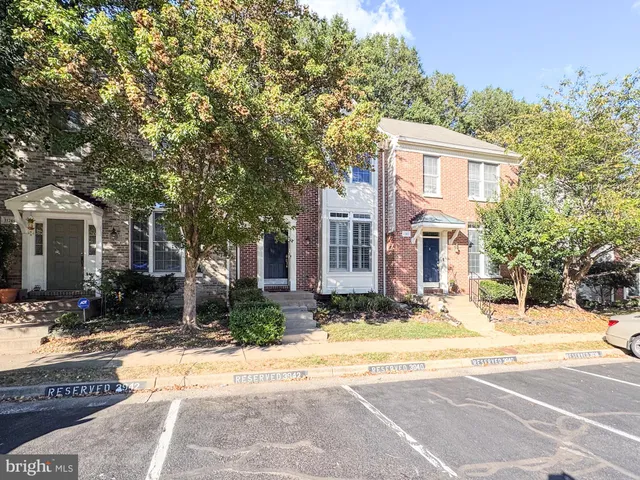a view of house with yard in front of it