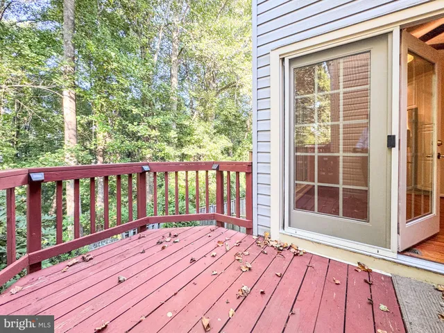 a view of balcony with wooden floor