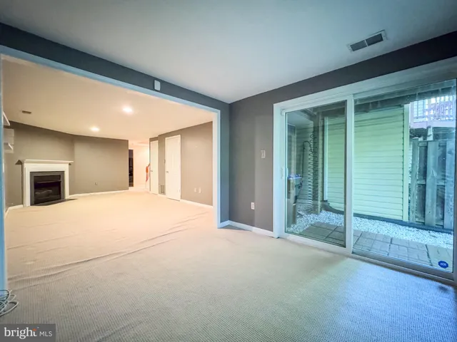 a big room with closet and a large window