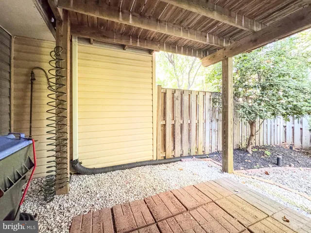 a view of outdoor space with wooden floor