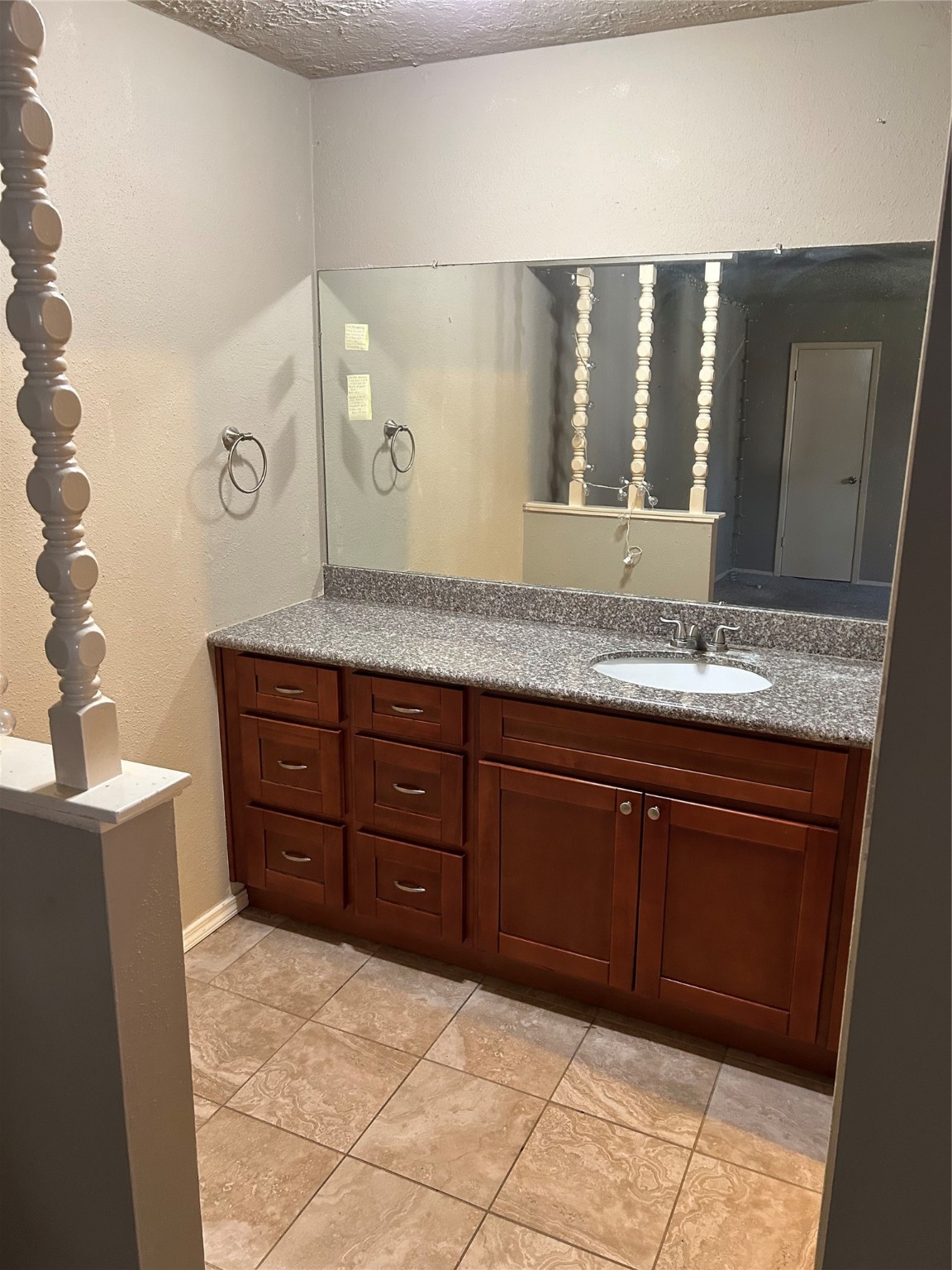 23119 Tree Bright Lane Spring, TX 77373 - Photo 17 of 17 a bathroom with a granite countertop sink and a mirror