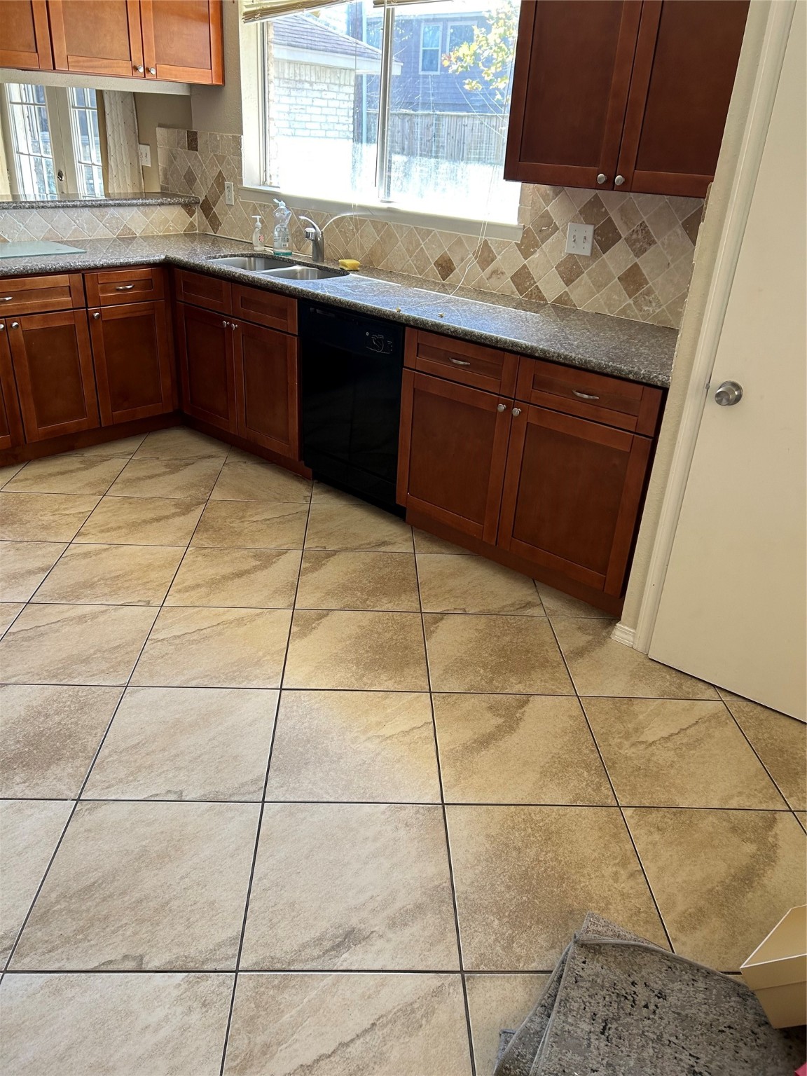 23119 Tree Bright Lane Spring, TX 77373 - Photo 2 of 17 a kitchen with stainless steel appliances a sink cabinets and window