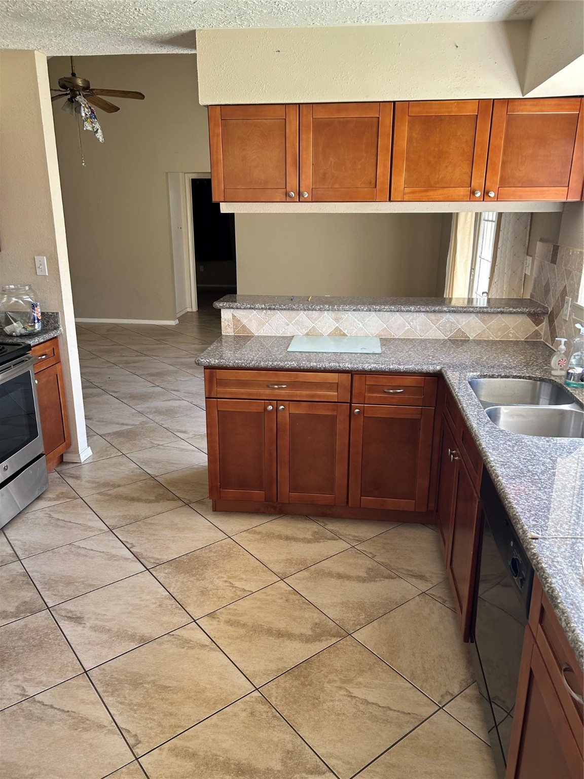 23119 Tree Bright Lane Spring, TX 77373 - Photo 4 of 17 a view of kitchen with granite countertop window